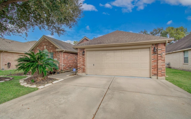 ranch-style home featuring a garage and a front yard