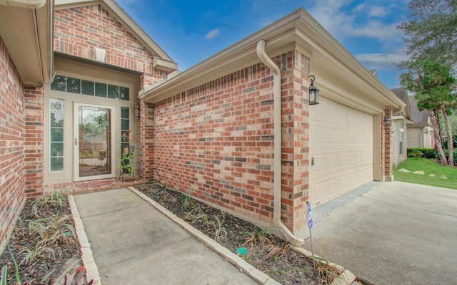 view of exterior entry with a garage