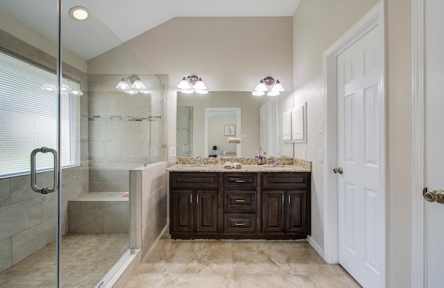 bathroom with lofted ceiling, vanity, and a shower with shower door