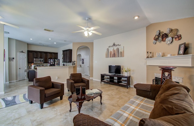 living room featuring lofted ceiling and ceiling fan