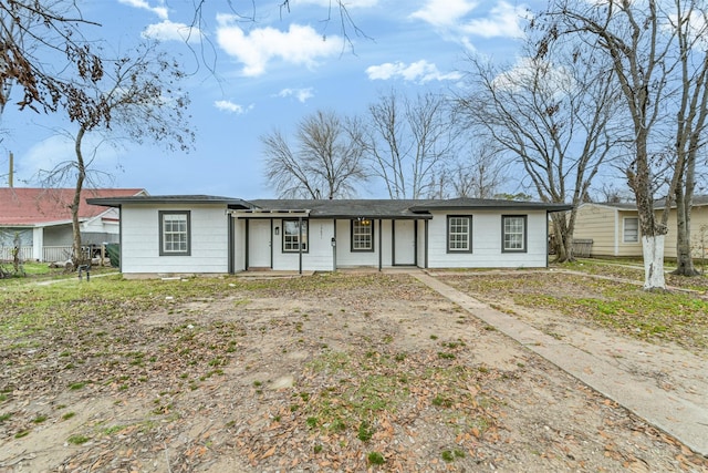 ranch-style home featuring covered porch