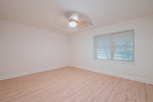 spare room with ceiling fan and light hardwood / wood-style flooring