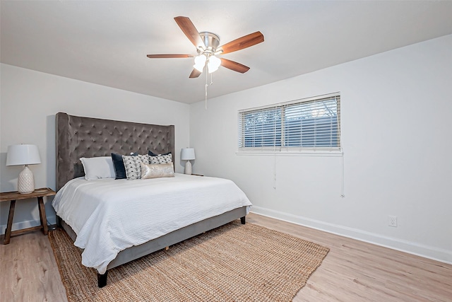 bedroom featuring light hardwood / wood-style floors and ceiling fan