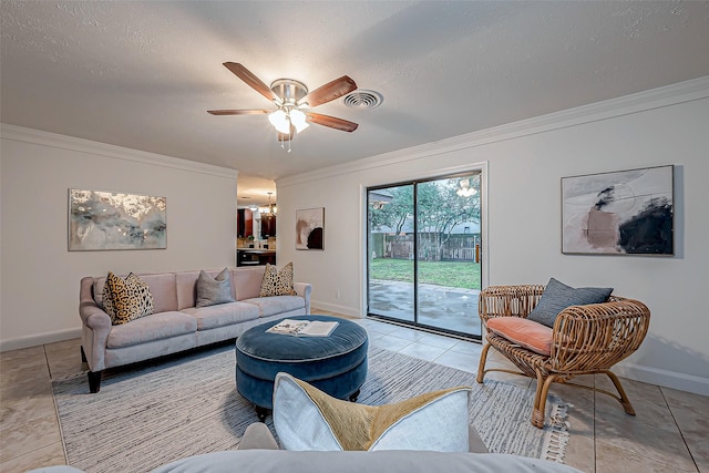 living room featuring light tile patterned floors, crown molding, a textured ceiling, and ceiling fan