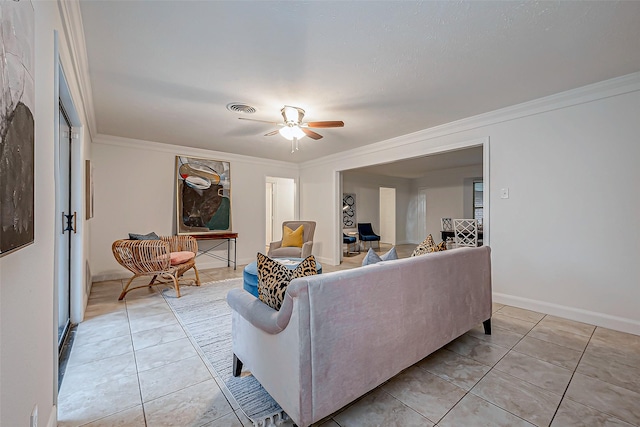 living room with crown molding, light tile patterned floors, and ceiling fan