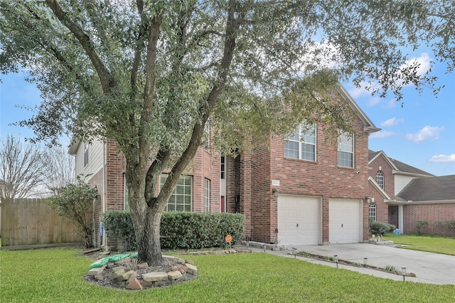 view of front of house featuring a garage and a front yard