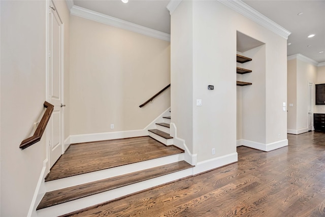 stairway with baseboards, ornamental molding, recessed lighting, and wood finished floors