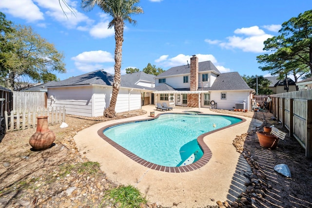 view of swimming pool featuring a patio, central AC, a fenced backyard, and a fenced in pool