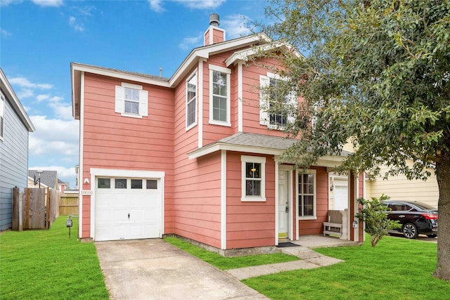 view of front of property featuring a garage and a front yard