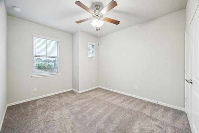 carpeted empty room with ceiling fan