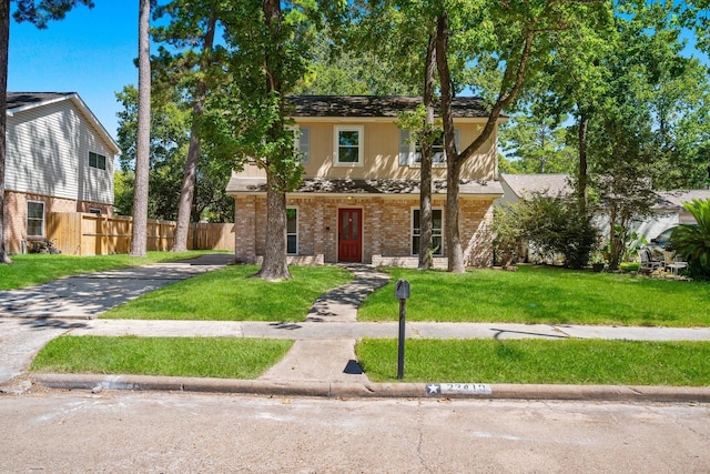 view of front of home featuring a front lawn