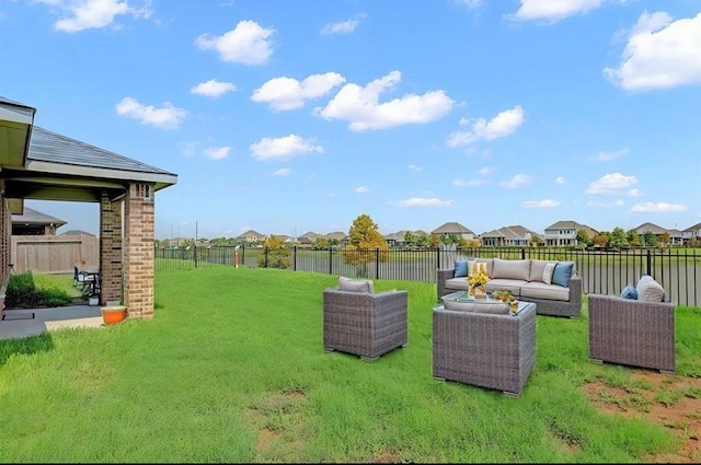 view of yard with outdoor lounge area and fence