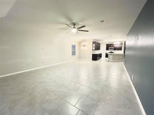 unfurnished living room featuring visible vents, baseboards, lofted ceiling, light tile patterned floors, and ceiling fan with notable chandelier