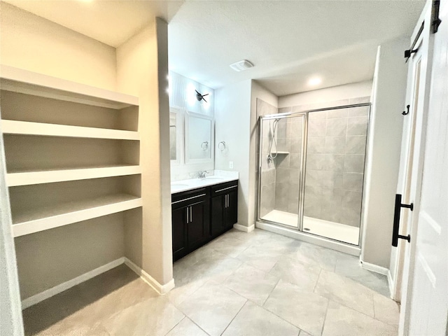 bathroom featuring visible vents, a shower stall, vanity, and baseboards