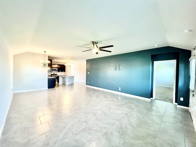 unfurnished living room with ceiling fan and vaulted ceiling