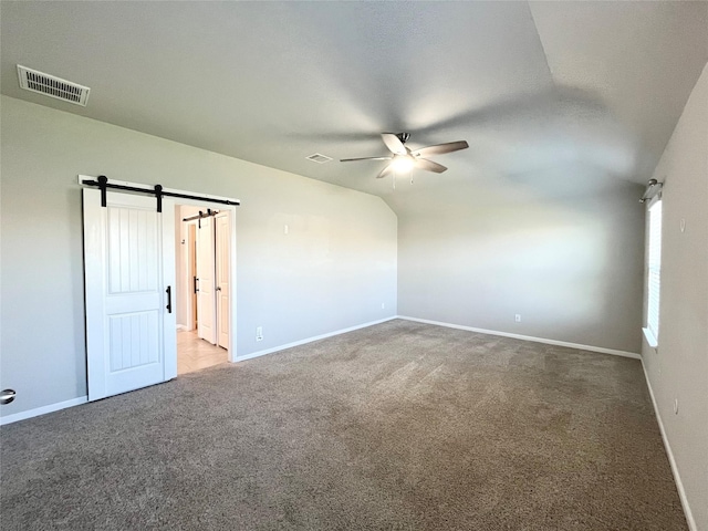 unfurnished room featuring a ceiling fan, visible vents, carpet floors, and baseboards