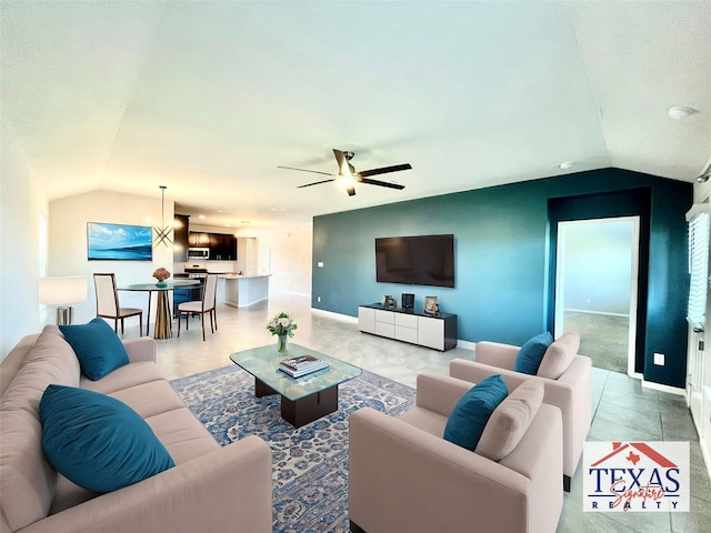 living room with vaulted ceiling, baseboards, and ceiling fan