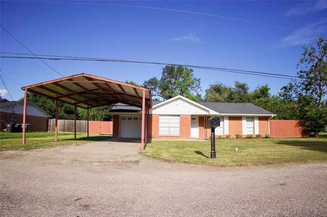 ranch-style home with a garage, a front yard, and a carport