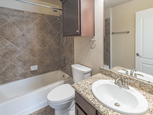 full bathroom with vanity, toilet, and tiled shower / bath combo