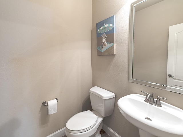 bathroom with toilet and sink