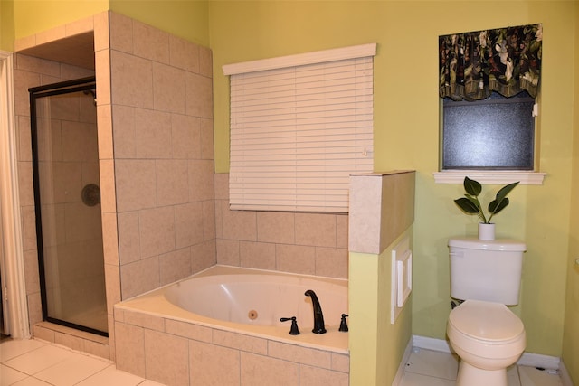 bathroom featuring tile patterned floors, toilet, and separate shower and tub