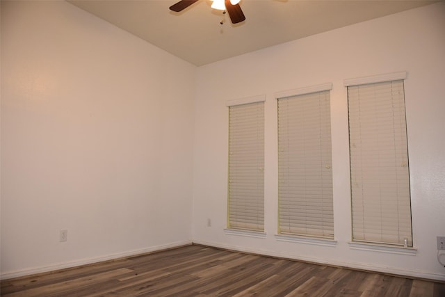 unfurnished bedroom featuring ceiling fan and dark hardwood / wood-style flooring