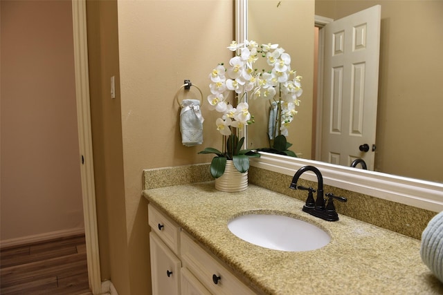 bathroom with vanity and wood-type flooring