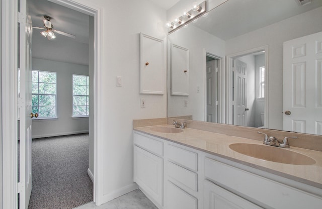 bathroom with ceiling fan, vanity, and toilet