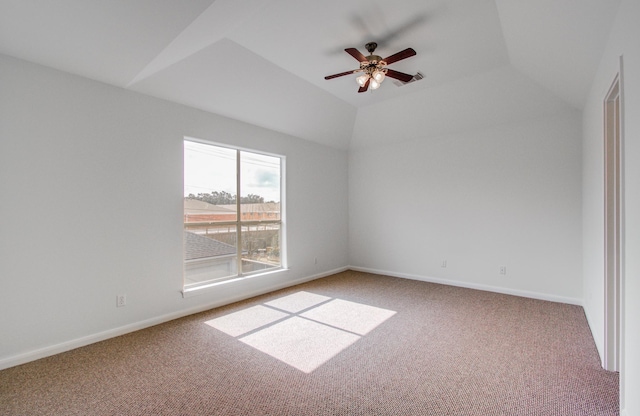 unfurnished room with ceiling fan, lofted ceiling, and carpet