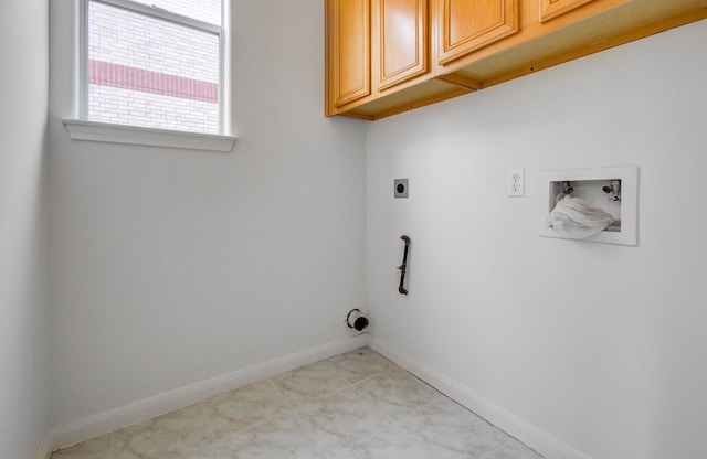 washroom featuring cabinets, hookup for a washing machine, and hookup for an electric dryer