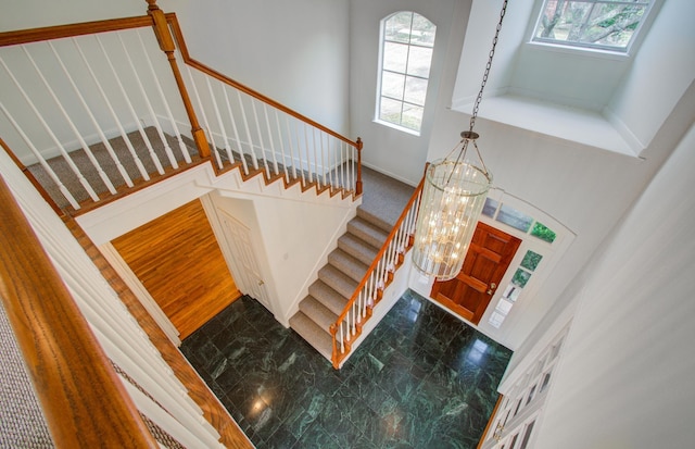 entrance foyer featuring a high ceiling and a notable chandelier