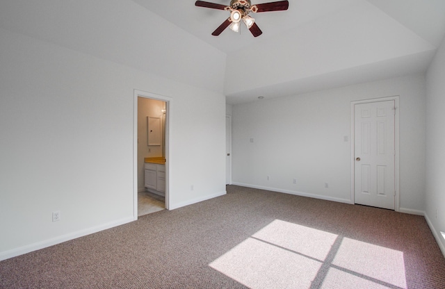 unfurnished bedroom featuring lofted ceiling, carpet floors, and ensuite bath