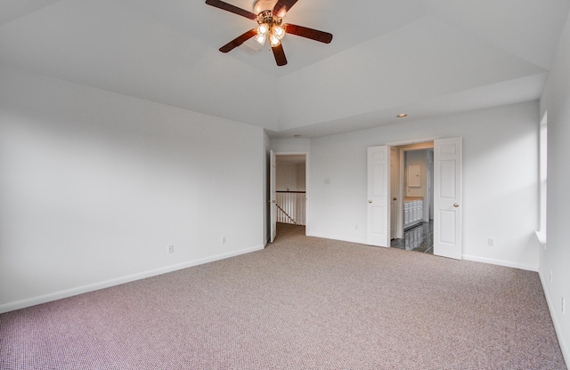 unfurnished bedroom featuring lofted ceiling, carpet flooring, and ceiling fan