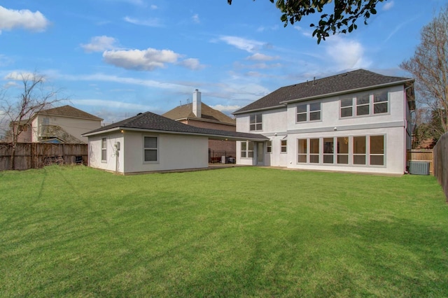 rear view of house with a lawn