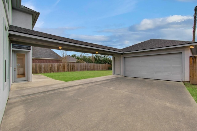 garage featuring a lawn