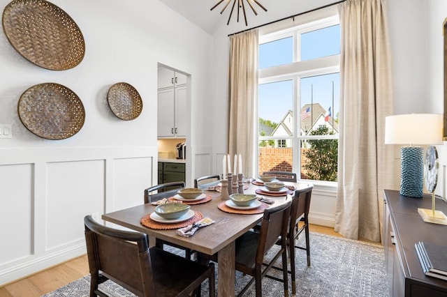 dining room with a chandelier and light wood-type flooring