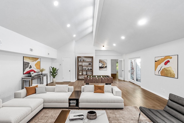 living room featuring visible vents, high vaulted ceiling, wood finished floors, recessed lighting, and baseboards