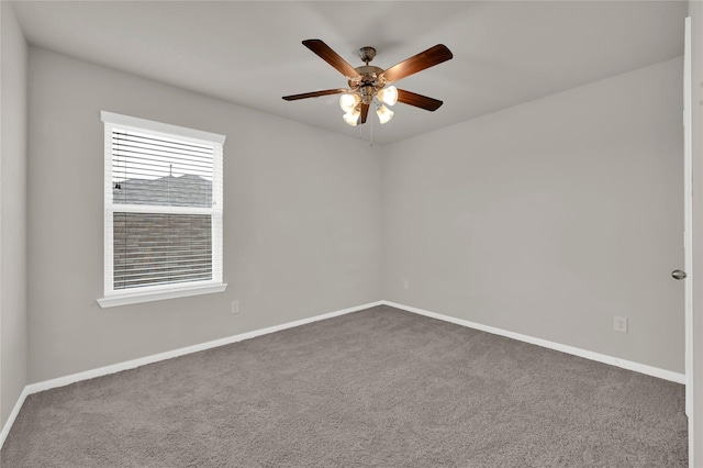 unfurnished room featuring ceiling fan and carpet floors