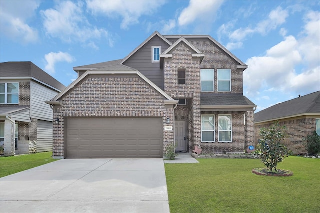 view of front of property featuring a garage and a front yard