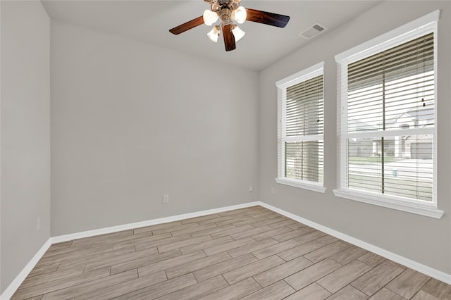 spare room with ceiling fan