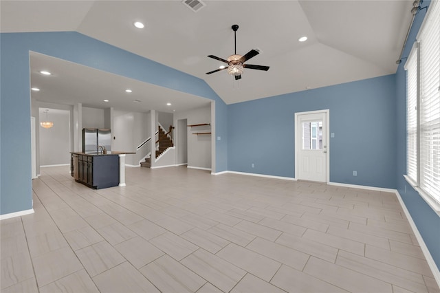 unfurnished living room with lofted ceiling and ceiling fan