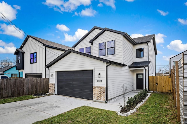 view of front property with a garage and a front lawn