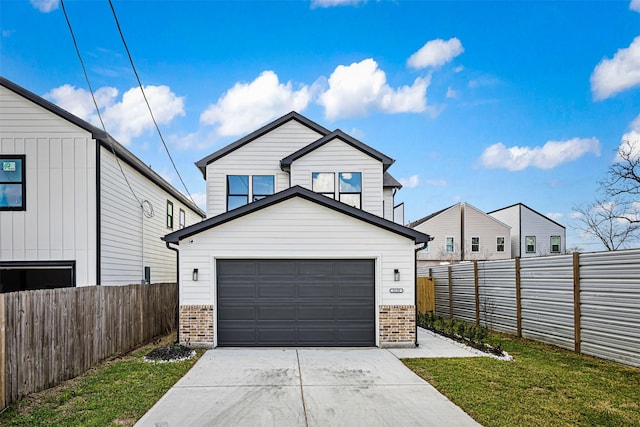 view of front facade with a garage and a front yard