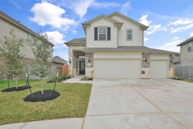 view of front of house with a garage and a front yard