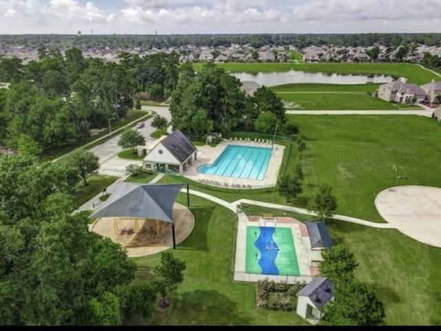 birds eye view of property with a water view