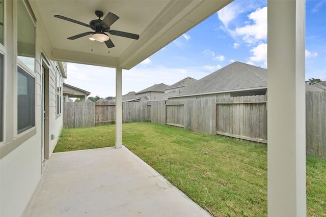 view of yard featuring a patio and ceiling fan