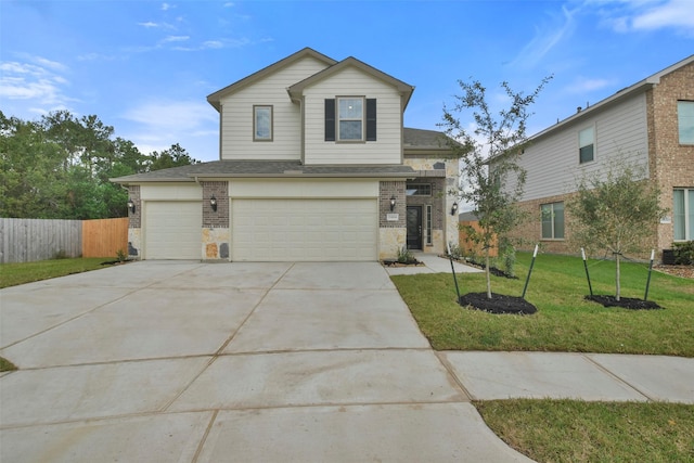 front facade featuring a garage and a front yard