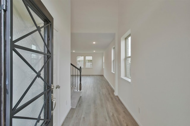 foyer with light wood-type flooring