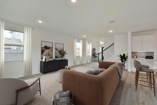 living room with light hardwood / wood-style floors