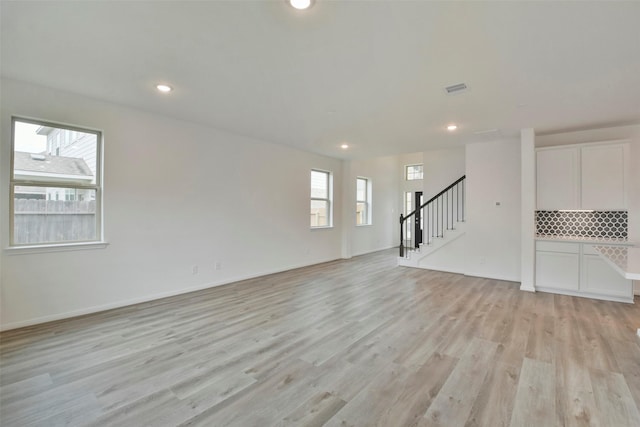 spare room featuring light wood-type flooring